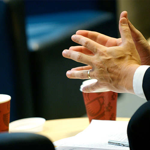 male_hands_and_coffee_cups.jpg